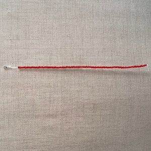 All red choker, adjustable, and very bright!